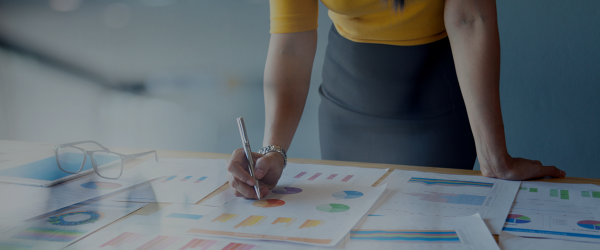 Woman stood over desk